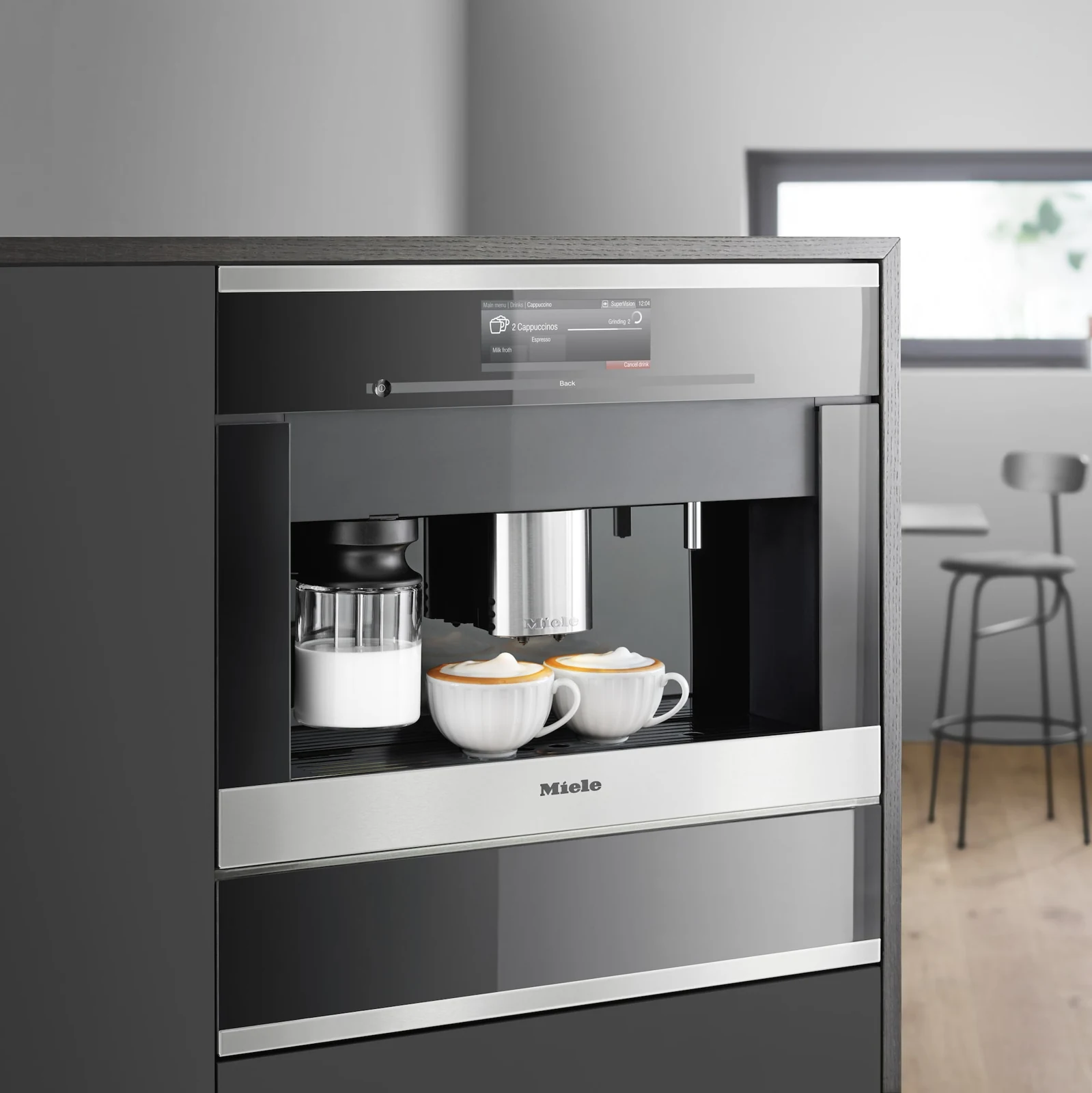 Miele built-in coffee appliance integrated into residential cabinetry